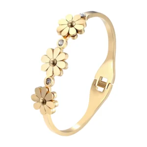 Gold-tone spring bangle with three chrysanthemum charms and crystal accents, Alkimia Charms jewelry