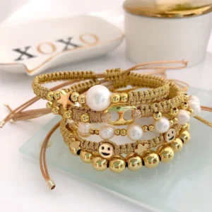 Handmade gold-thread bracelet with natural pearls, smiley charm, and star accent, Alkimia Charms jewelry
