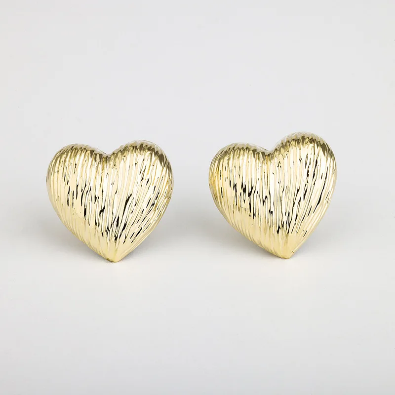 Brushed satin-metal heart earrings with a soft textured finish, Alkimia Charms jewelry