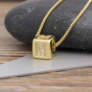 Gold-tone micro-pavé cube initial pendant necklace with A–Z letters, Alkimia Charms jewelry